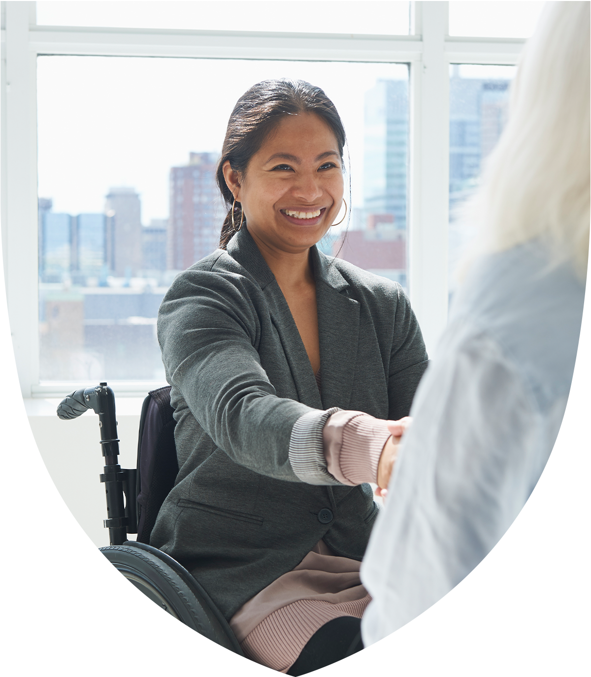 Special needs professional woman shaking hands with colleague 