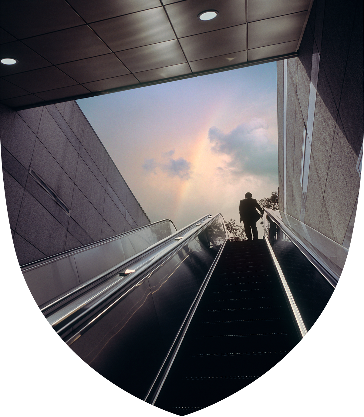 Man riding an escalator