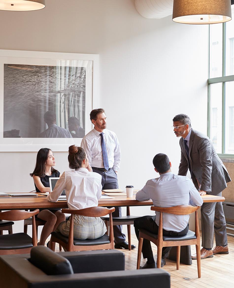 People around a table at a meeting
