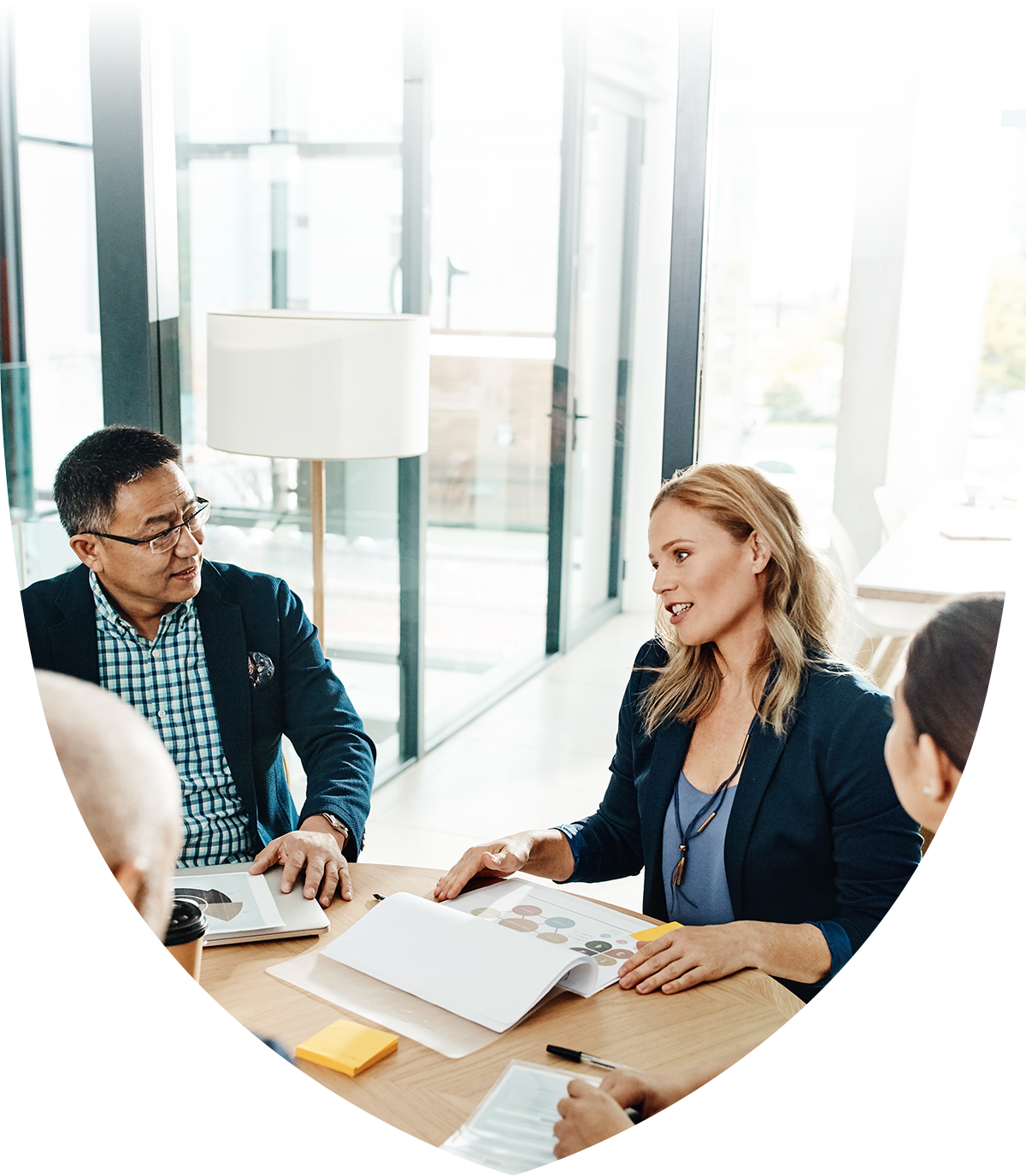 Image of people talking at a meeting