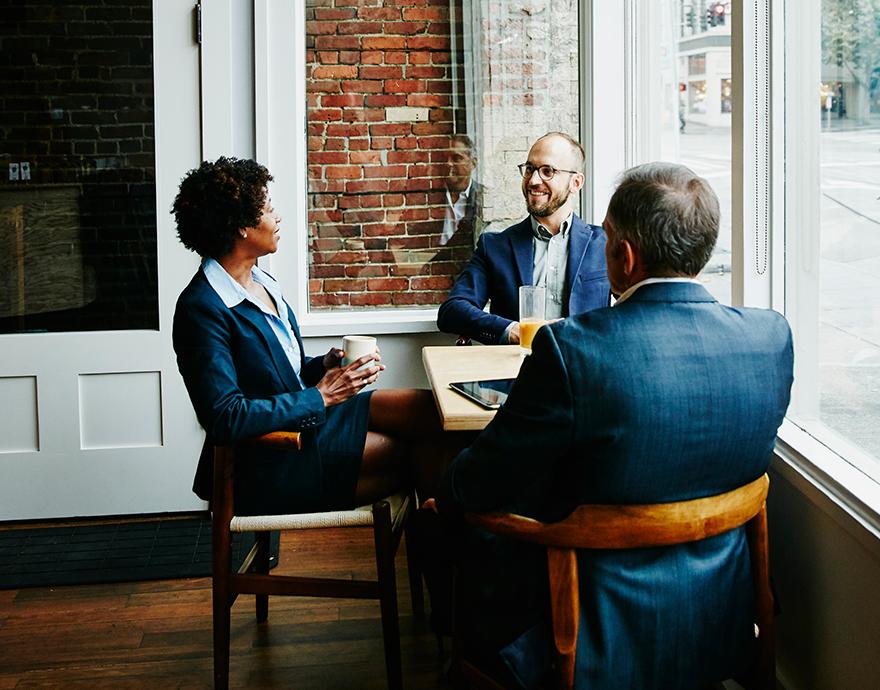 Diverse financial professionals talking in the conference room