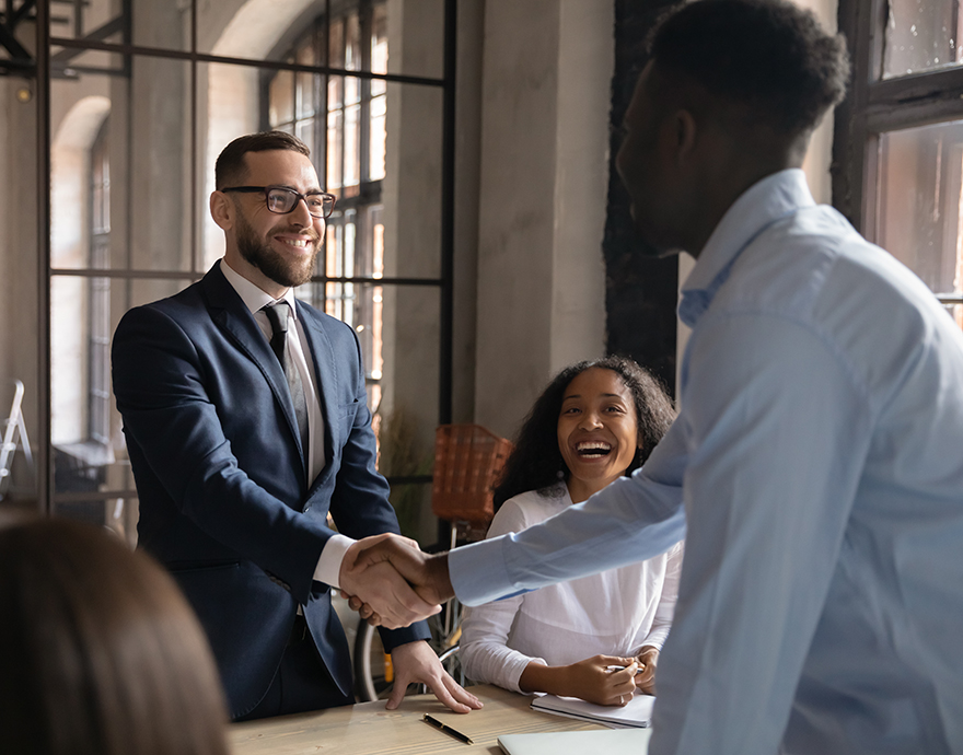 Diverse professionals shaking hands
