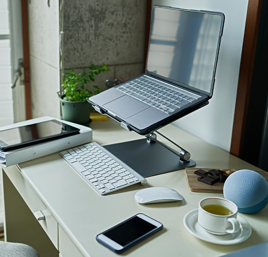 Image of a desk with a laptop on it 