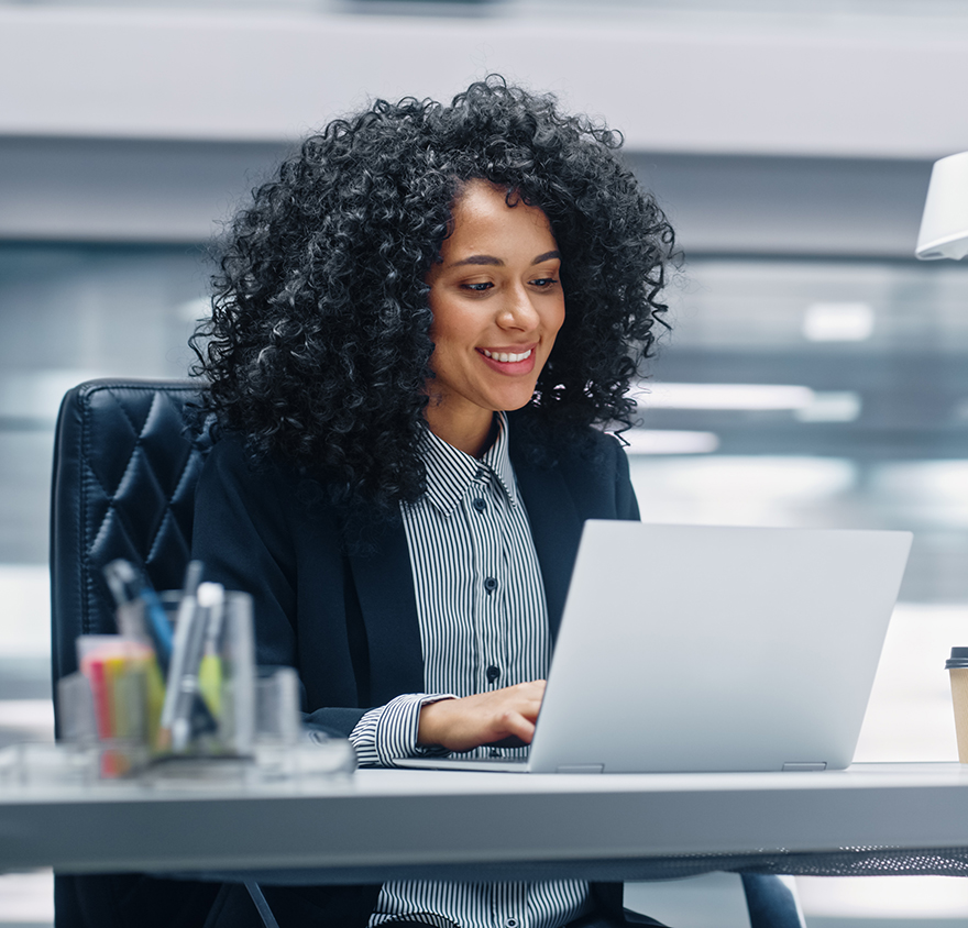 Woman looking at laptop