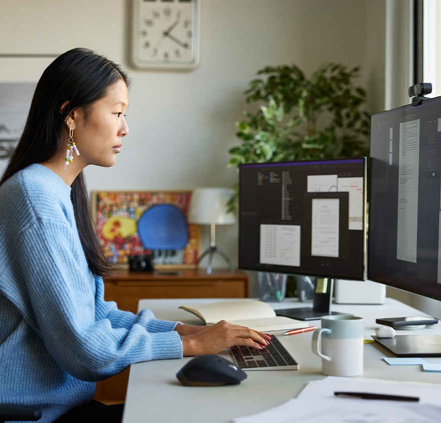 Woman working at a desktop computer 