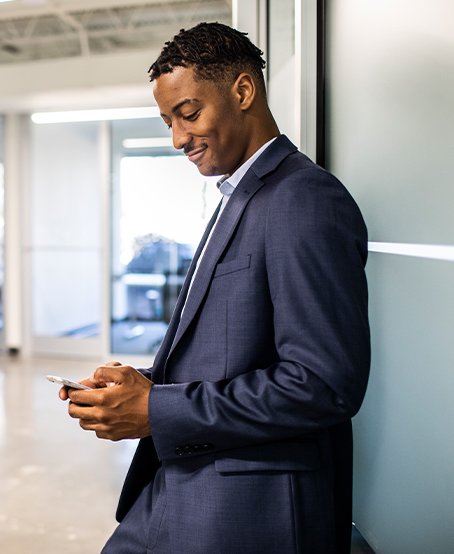 Man typing on a cell phone