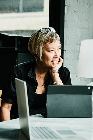 Woman sitting at a tablet