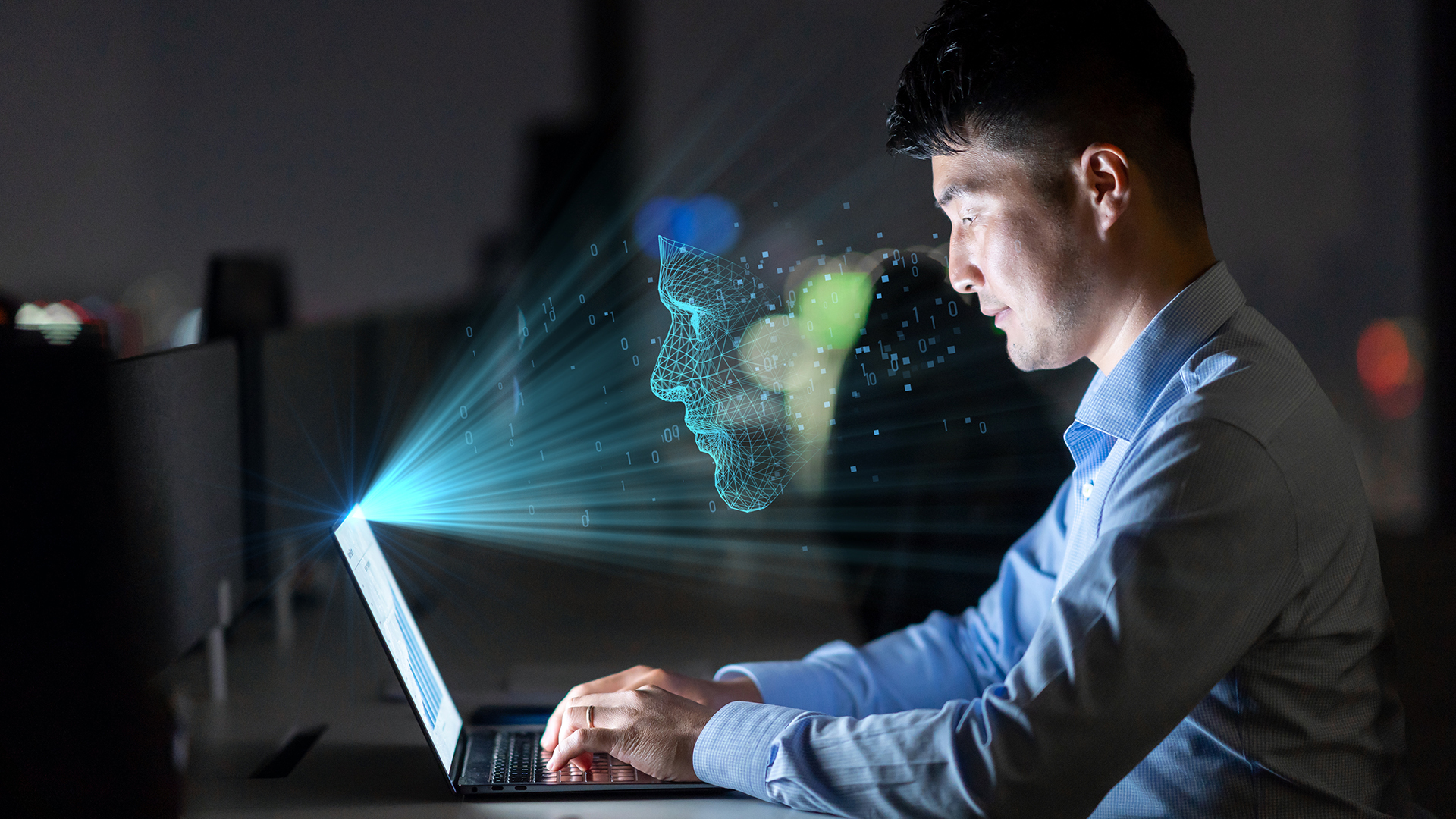 Businessman working on his laptop at night