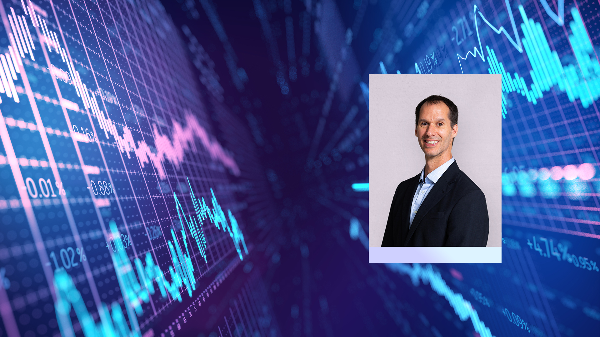 Photo of Eric Ludwig with stock market graphs behind him
