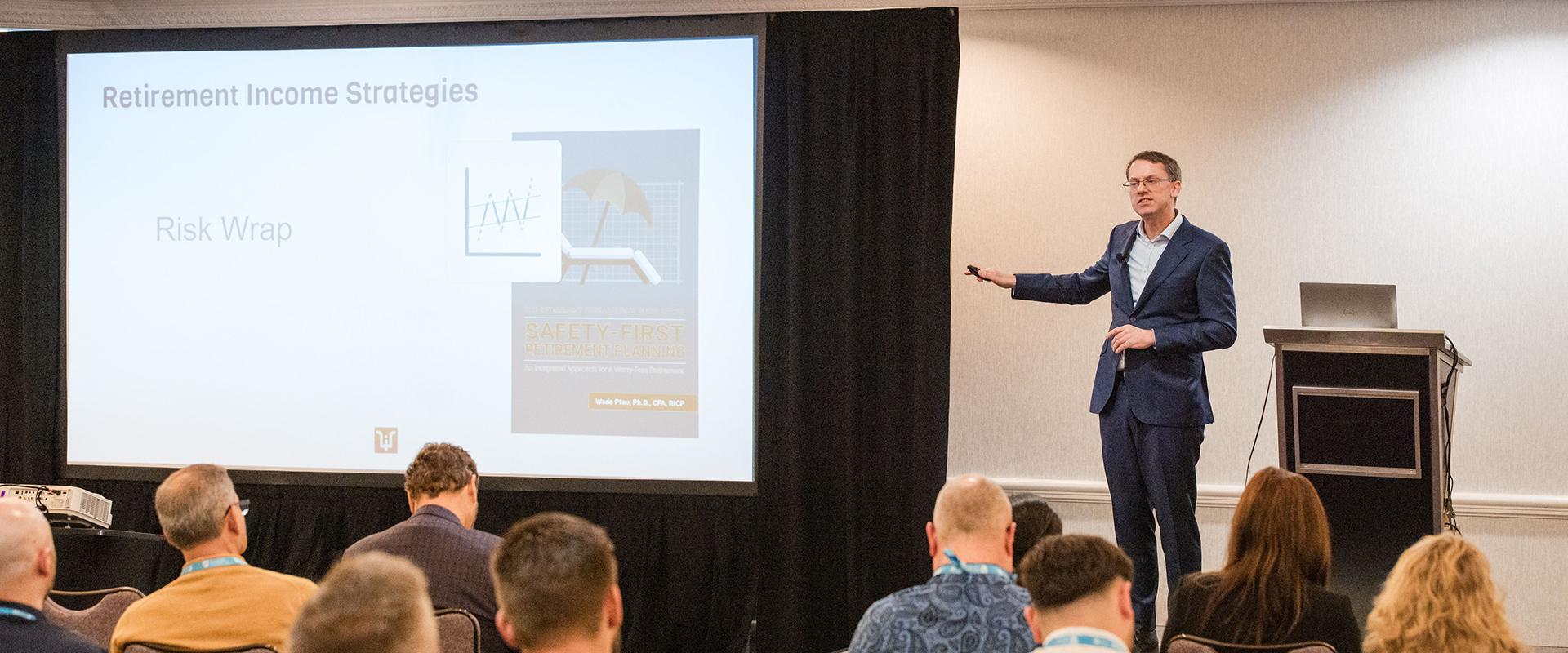 Wade Pfau presenting on stage at Horizons