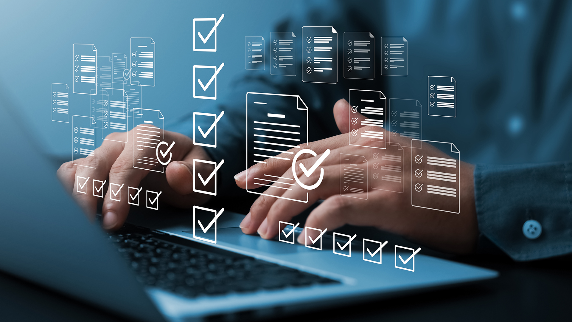 Man typing on his laptop