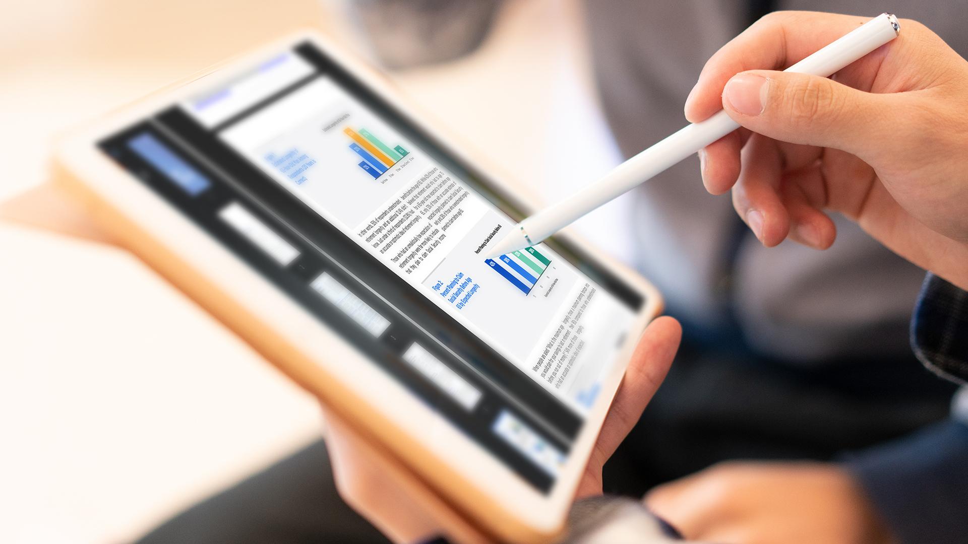 Man writing on his tablet with a stylus