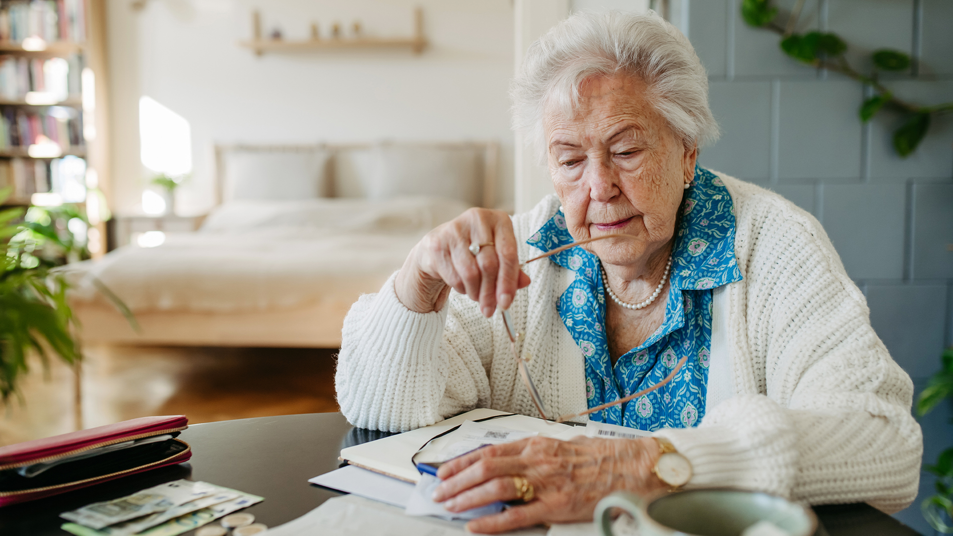 Retired elderly lady reviewing her finances