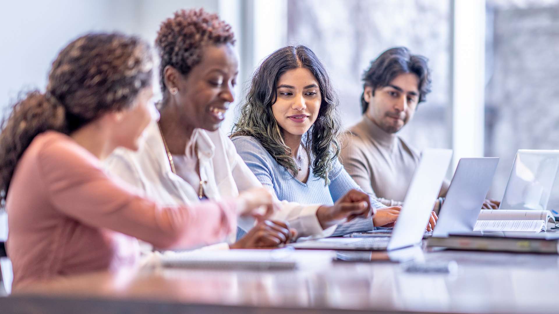 Diverse group of people sitting in the office together