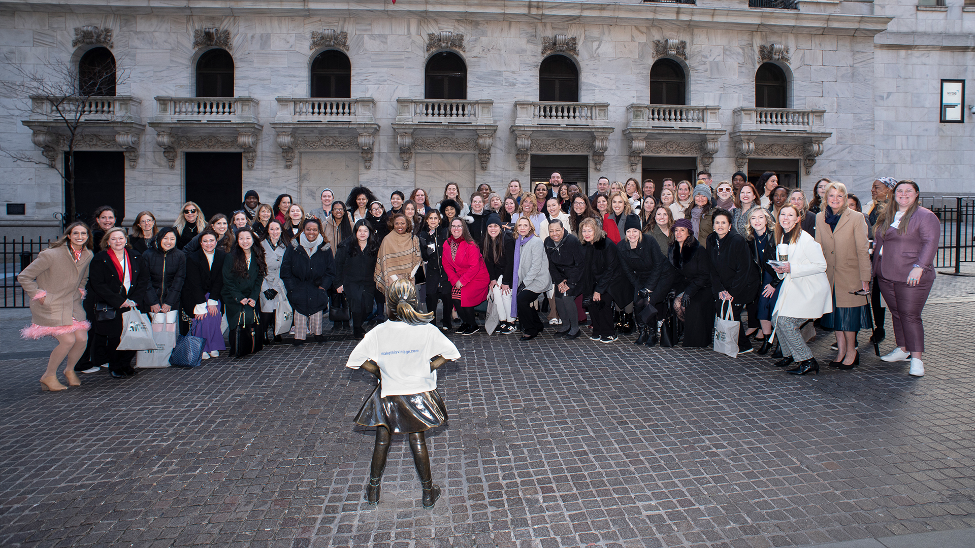 WWIW group photo in front of Fearless Girl statue