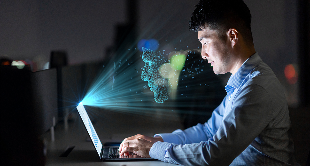 Businessman working on his laptop at night