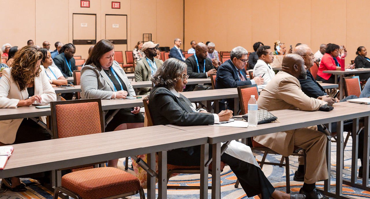 Attendees sitting in a conference hall