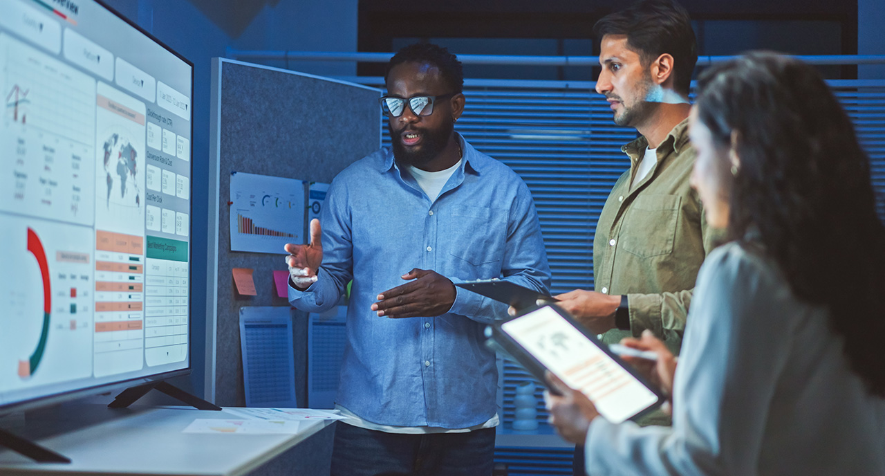 A work team looking at data and analytics together