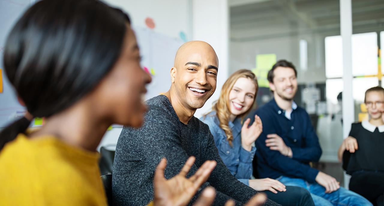Work team meeting and laughing together