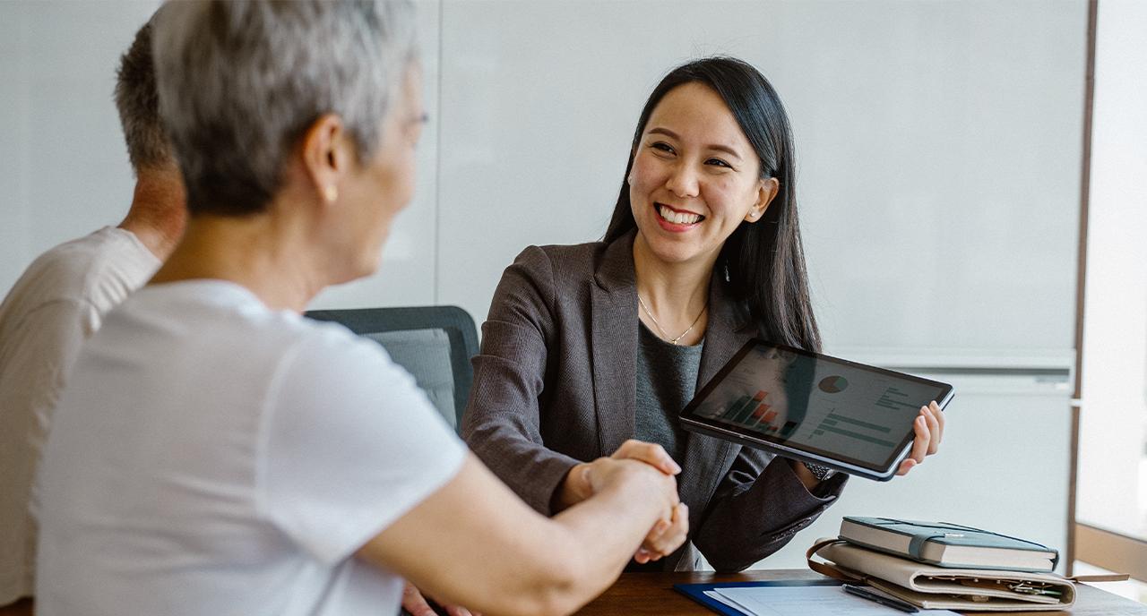 Female retirement advisor meeting with her clients
