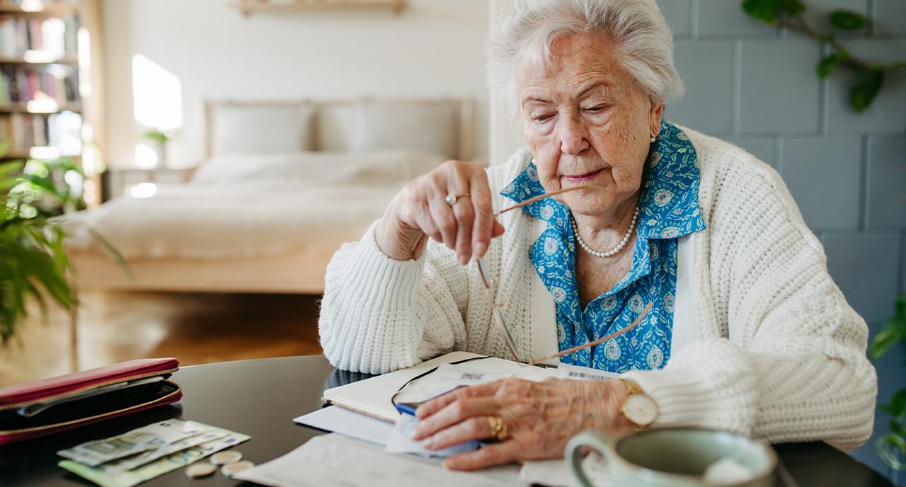Retired elderly lady reviewing her finances