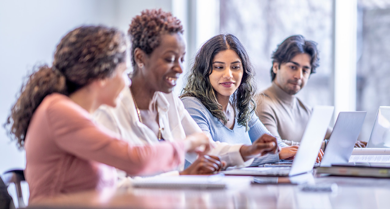 Group of diverse coworkers sitting together