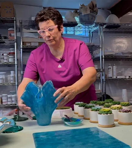 Woman making glass