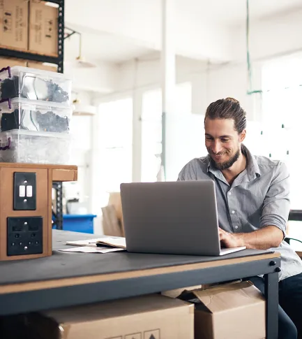 Man working on his laptop from home