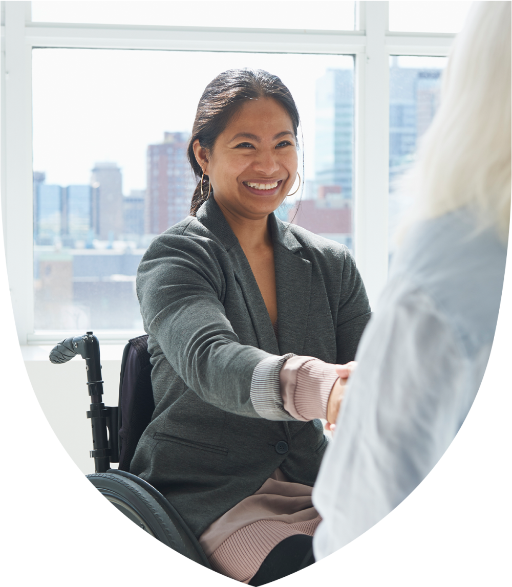Special needs professional woman shaking hands with colleague 