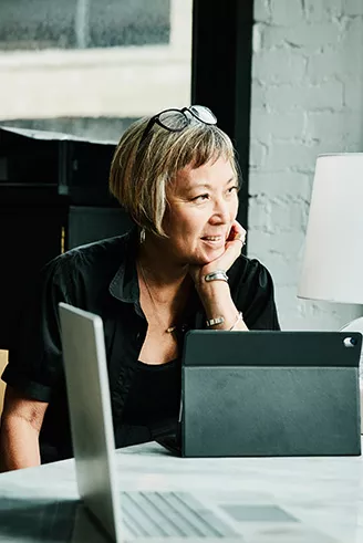 Woman sitting at a tablet