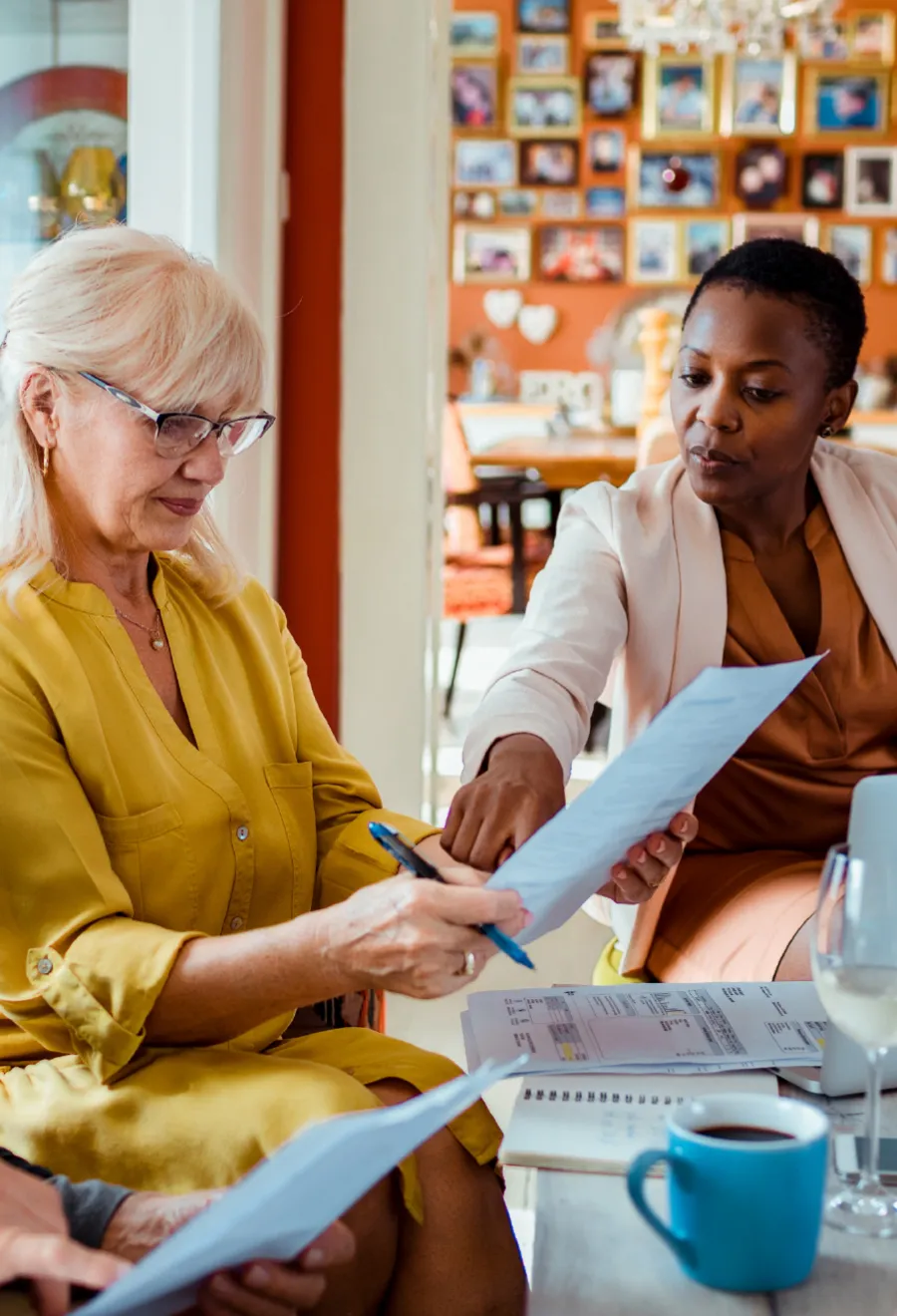 Female advisor speaking with her elderly client