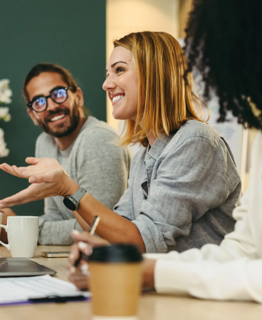 Young female professional smiling with in a meeting