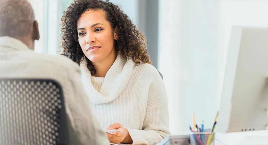 Female advisor meeting with her client in the office
