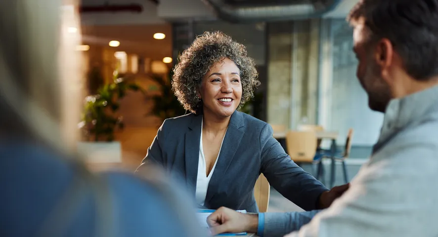 Female advisor meeting with a married couple