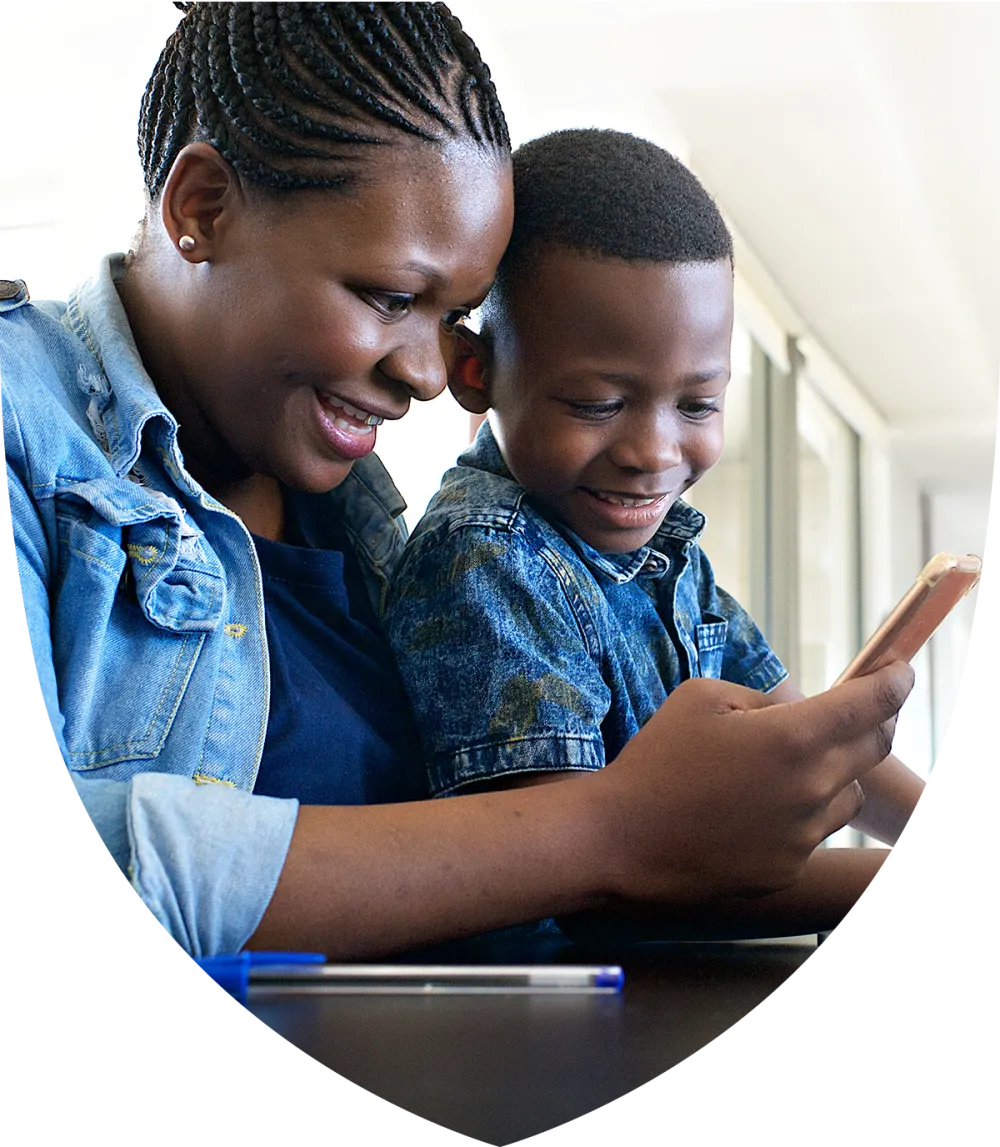 Mom and son looking at phone together smiling