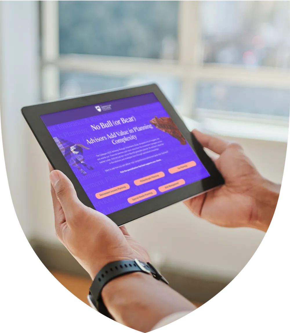 Man holding and looking at a tablet