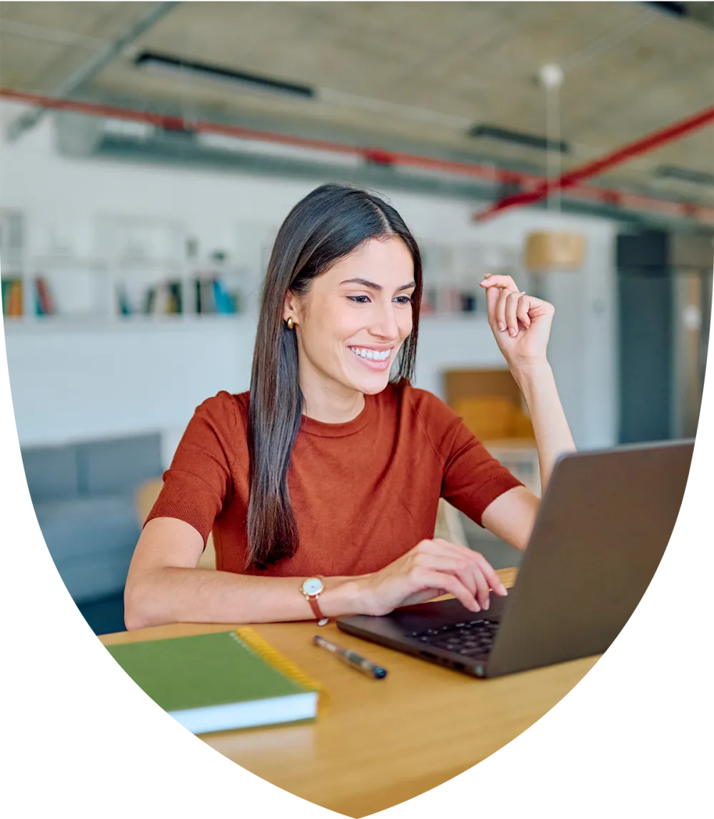Woman smiling while at her desk working