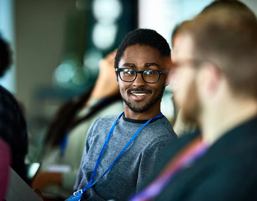 Two men networking at a conference