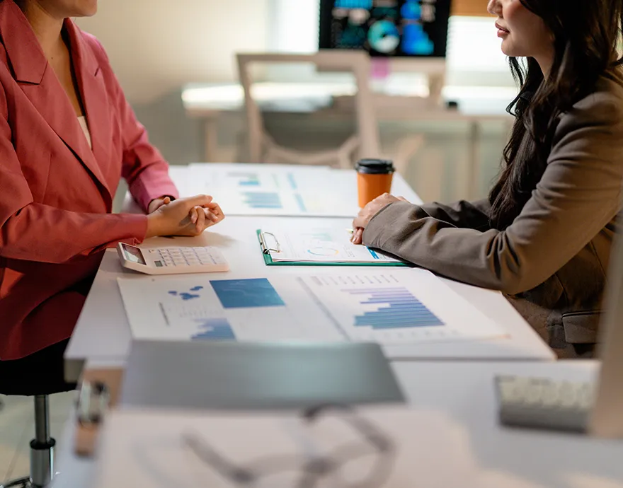 Two people talking at a table