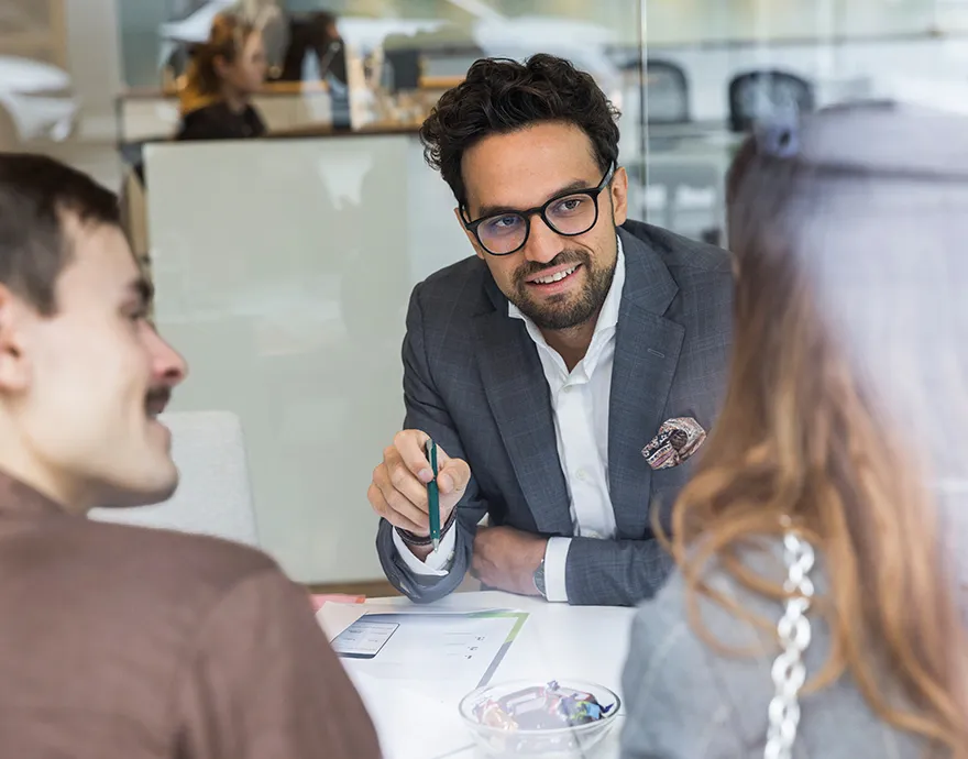 Financial advisor speaking with his clients