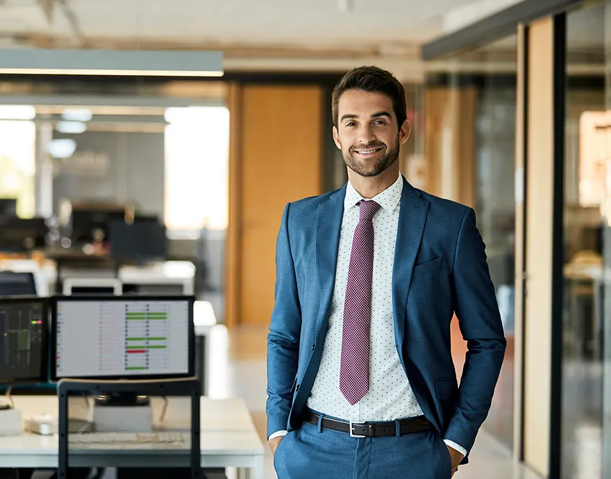 Middle aged professional male standing confidently and smiling