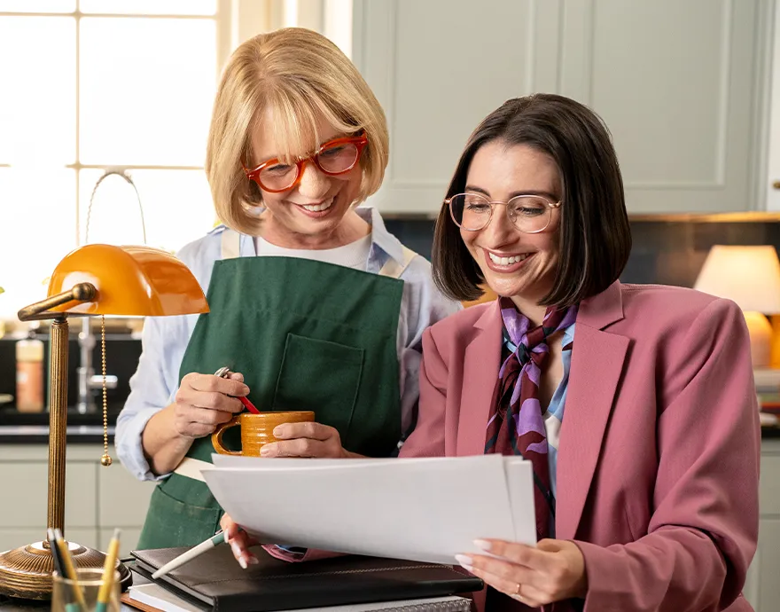 Female retiree speaking with her advisor and smiling
