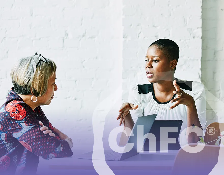 Woman speaking with her elderly client