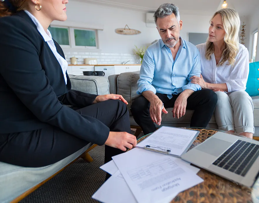 Woman looking at paperwork with her clients