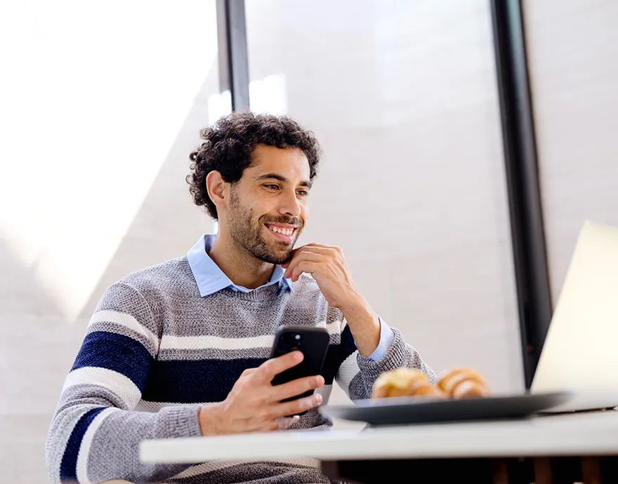 Man smiling while learning online