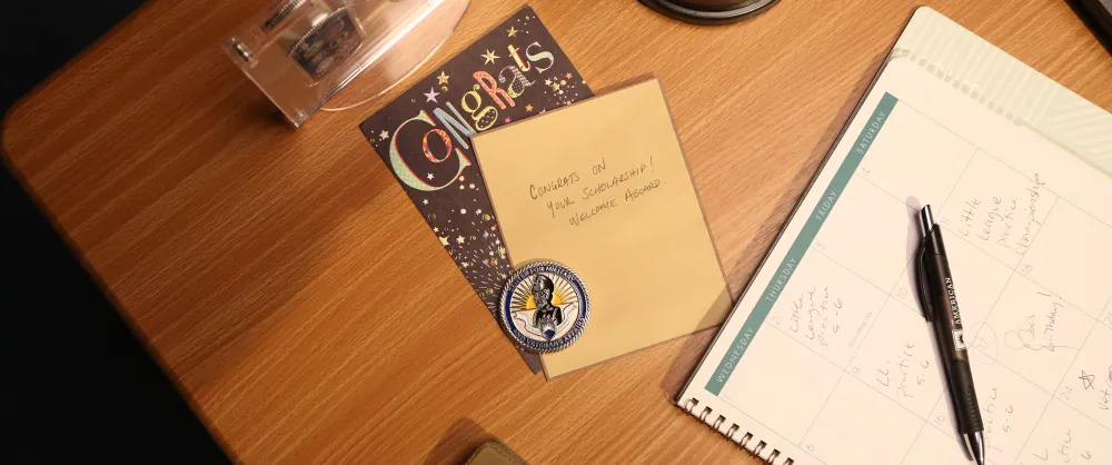 Hand written congratulations note on a table