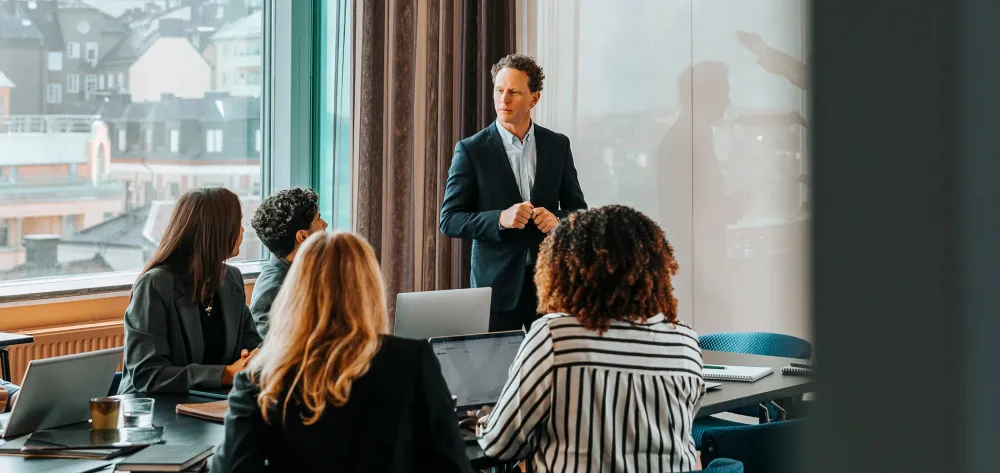Businessman speaking to a group of students