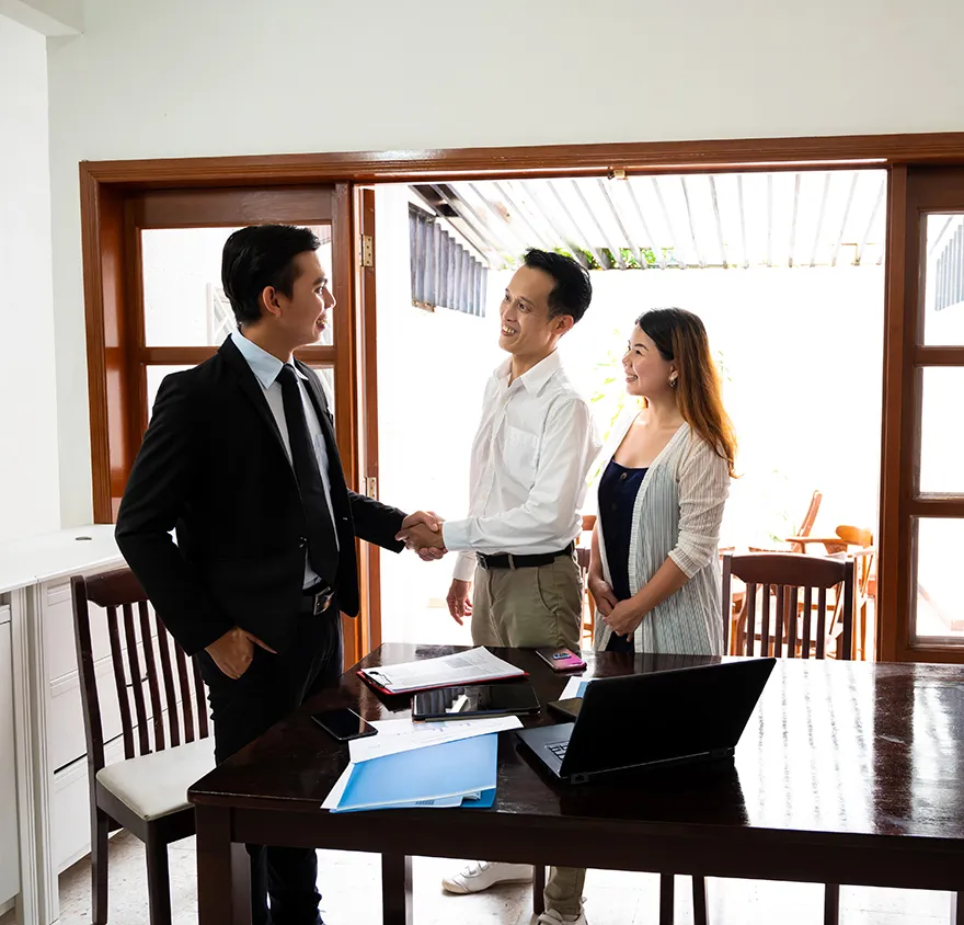 Advisor meeting with married couple in their home