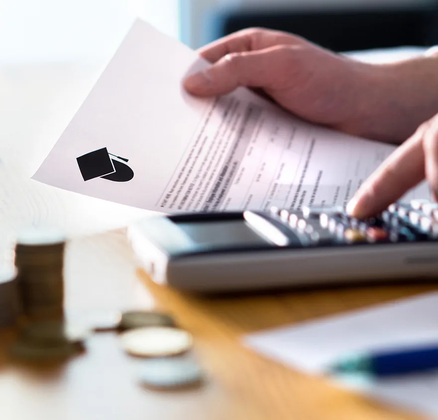 Man using a calculator at his desk