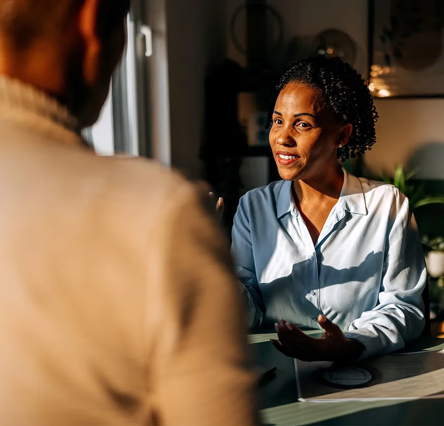 Woman smiling while talking with a friend